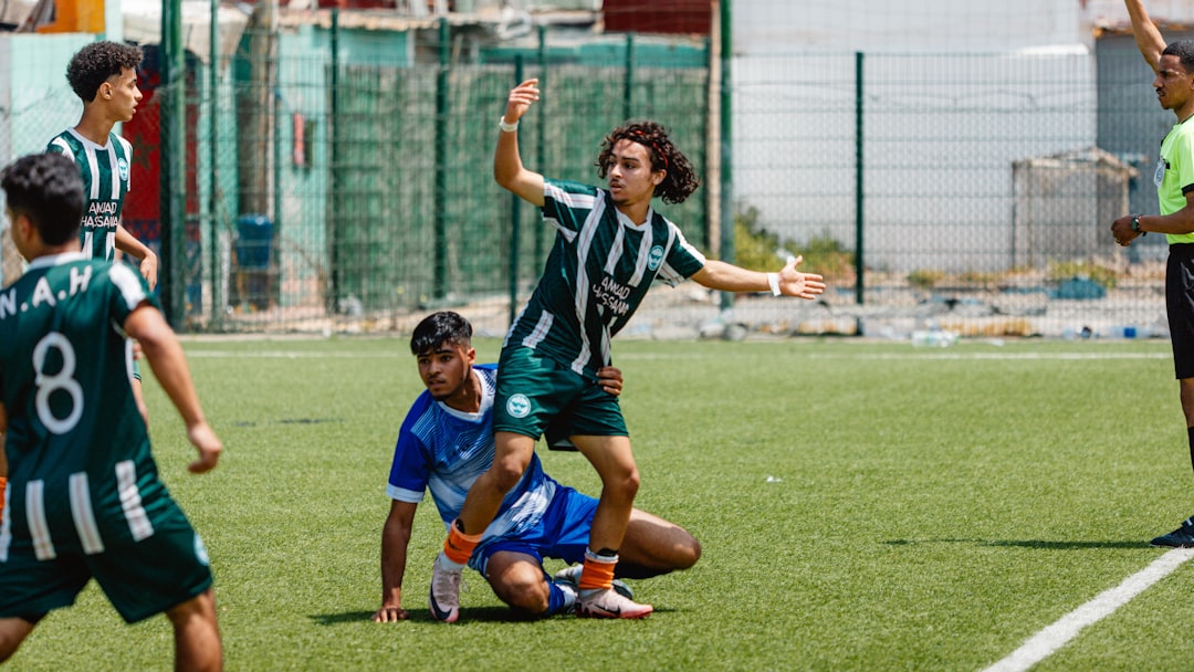 Soccer players are arguing after a foul. ronaldo messi football rivalry
