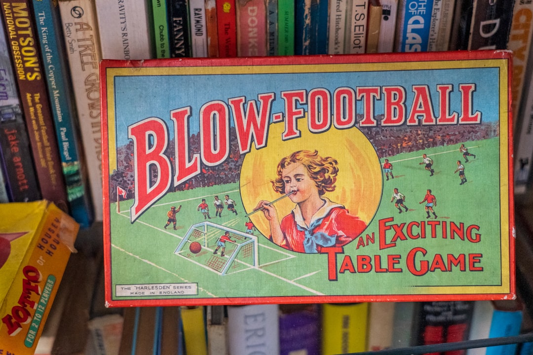 the big one book on brown wooden shelf soccer board game, football trivia, fan game night