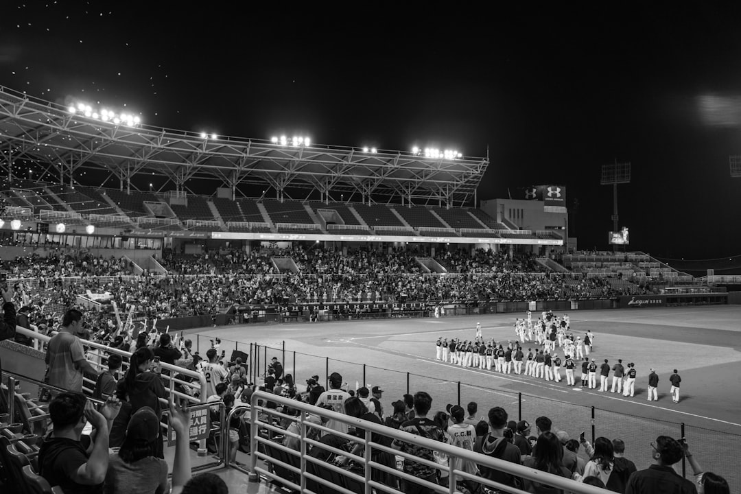 a crowd of people in a stadium boise stadium, blue turf, fans cheering