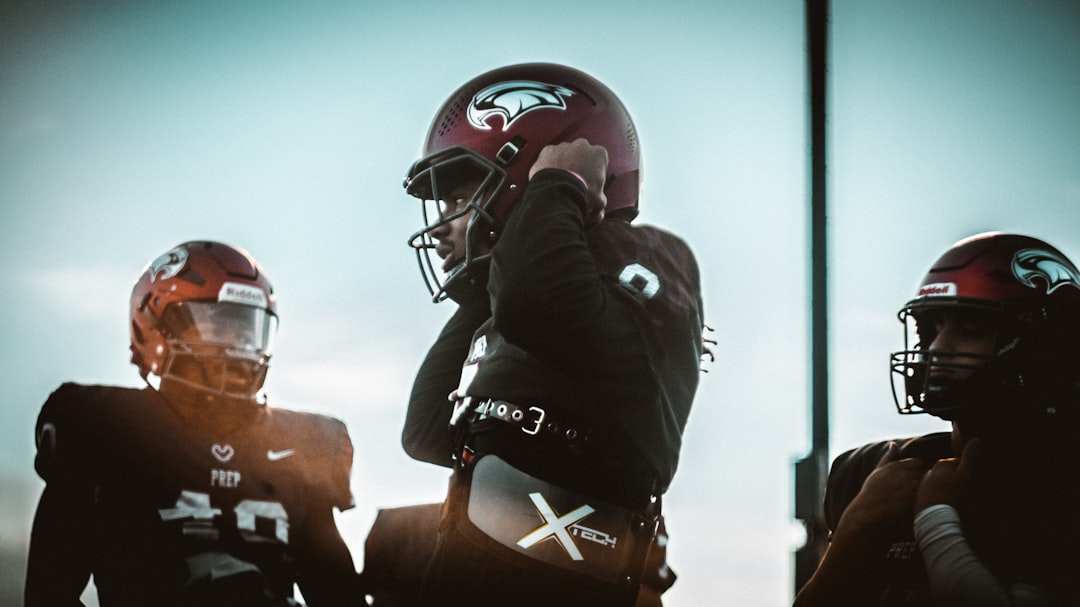 a group of football players college sports, ai recruiting, data analysis