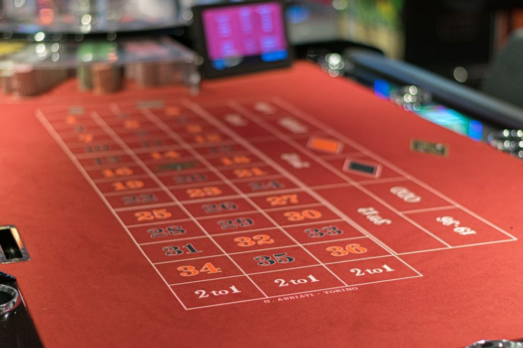 a red table with a lot of numbers on it football parlay betting, sports betting strategy, betting slips