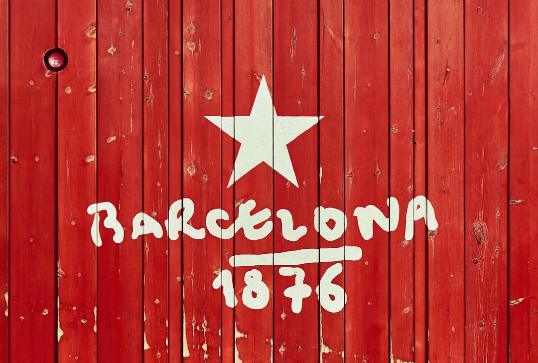 a red wooden wall with a white star painted on it barcelona benfica players match