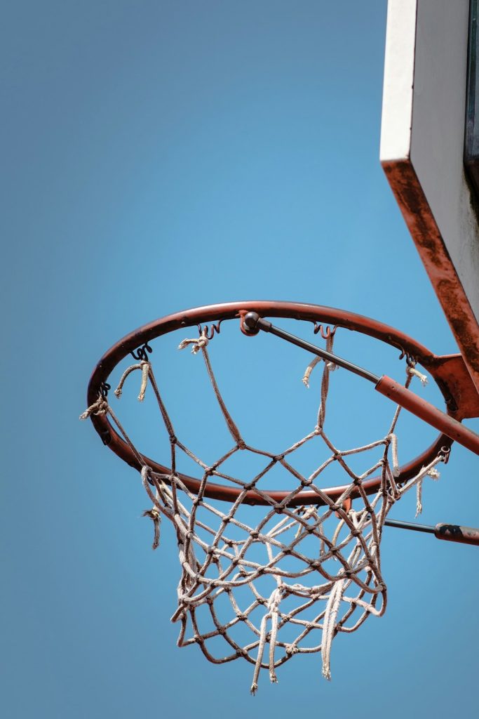 low angle photography of red and white basketball system kyrie irving crossover, nba handles, basketball court fall