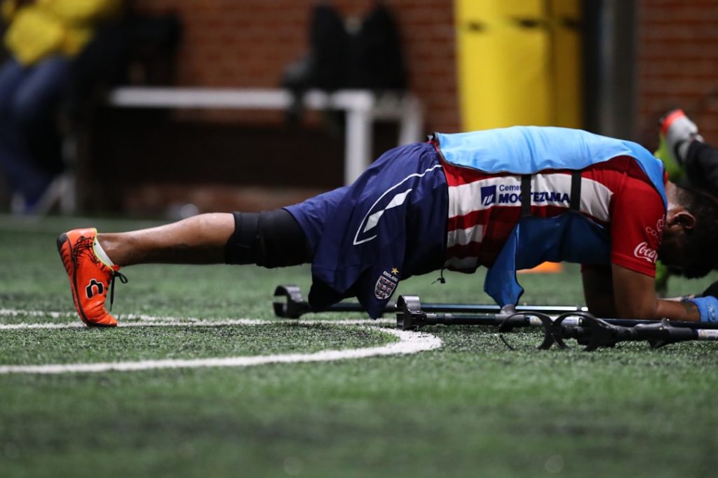 man doing push up during daytime baylor quarterback injury, sawyer robertson, blake shapen, football sideline
