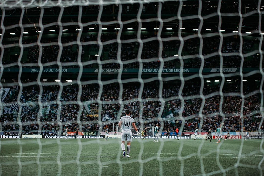 man standing on green soccer field vinicius junior, takefusa kubo, real madrid vs real sociedad