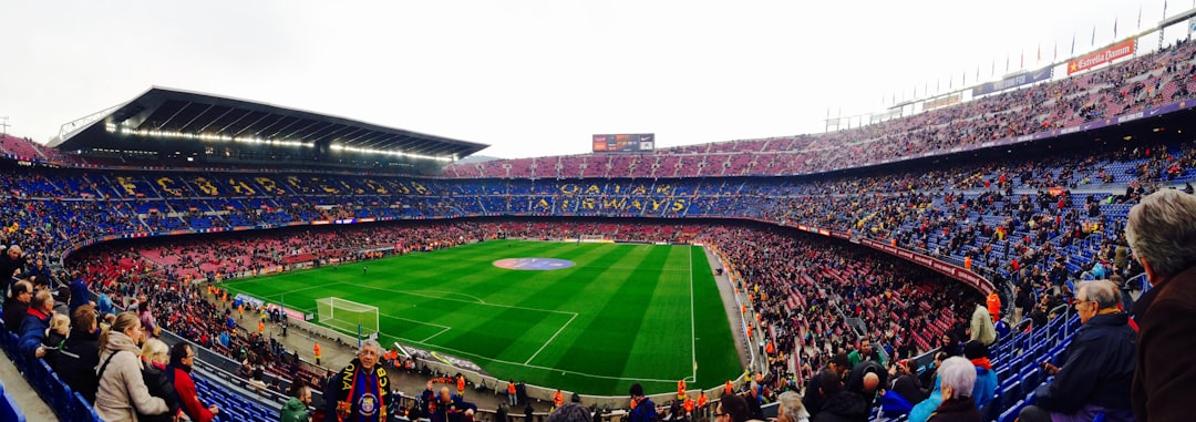panoramic photography of people inside a soccer stadium camp nou stadium barcelona atmosphere