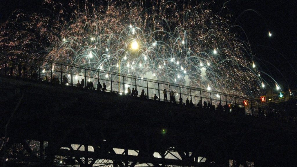 photo of firework displays during night time goal celebration, sevilla match, european night