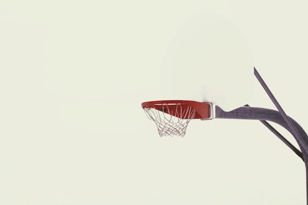 red and black basketball hoop devin booker, luka doncic, nba rivalry