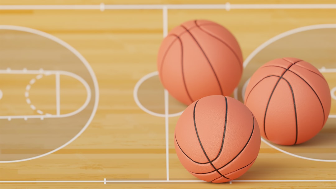 three basketballs sitting on top of a basketball court fantasy sports, player stats, prize picks app