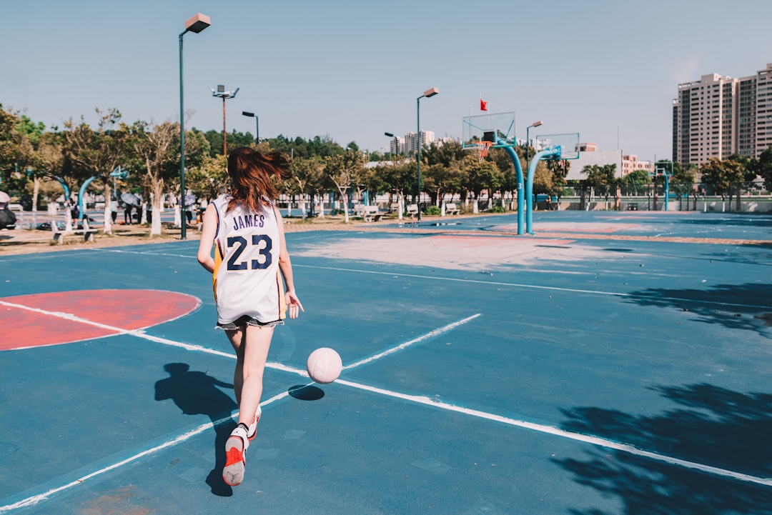 time lapse photography of woman dribbling a ball young athlete, viral sports video, basketball prodigy