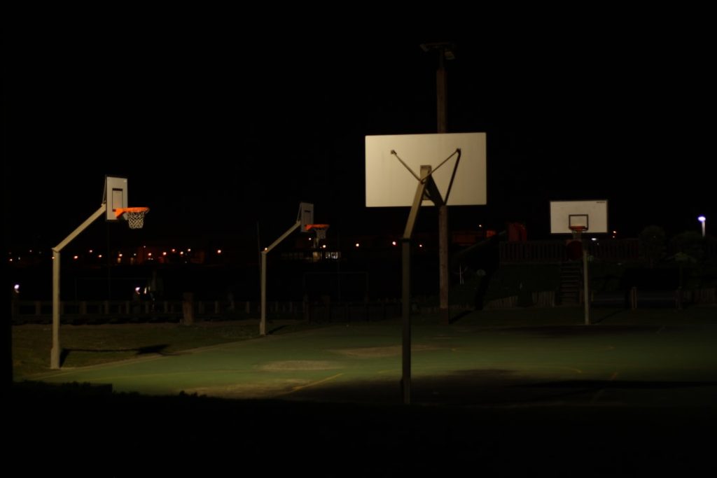 a basketball court at night with a basketball going through the hoop basketball film session video playlist
