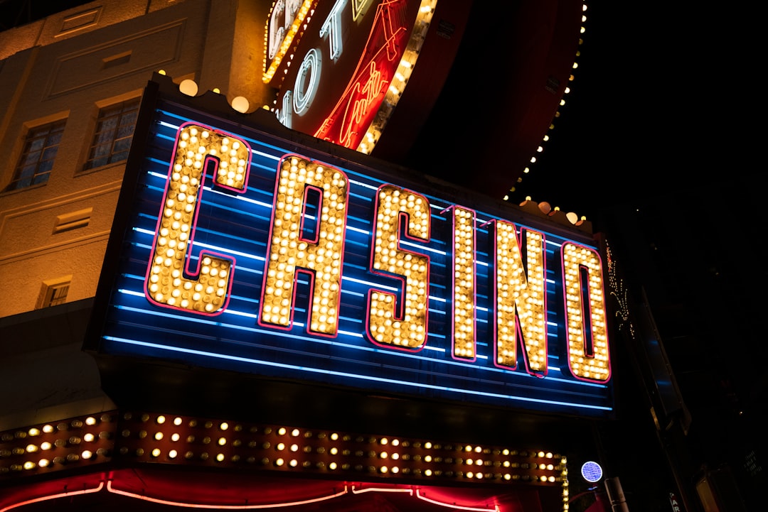 a building with neon signs casino bonus, welcome offer, online betting rewards, vip promotions