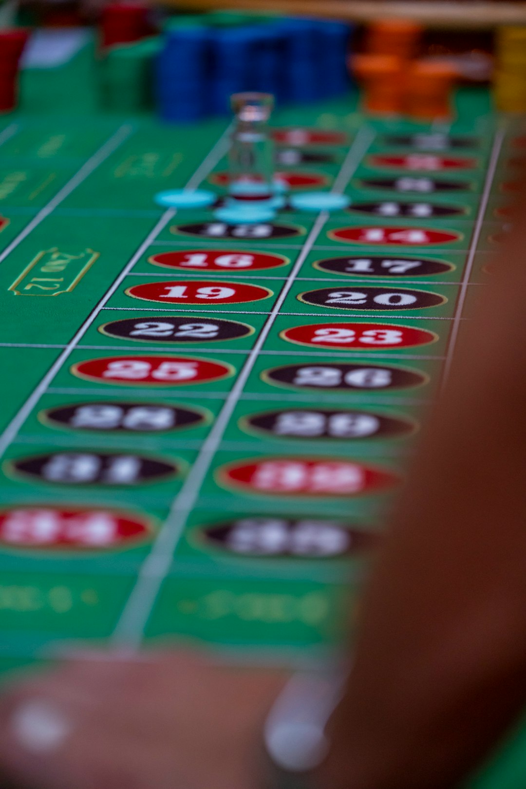 a close up of a casino table with a lot of chips live sports betting, fluctuating odds, sportsbook interface