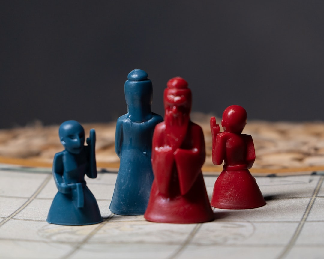 a close up of a game board with pieces of plastic decision making, risk management, losing and winning
