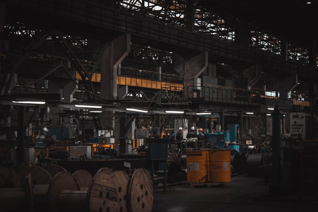 A factory filled with lots of machines and machinery manufacturing machinery production