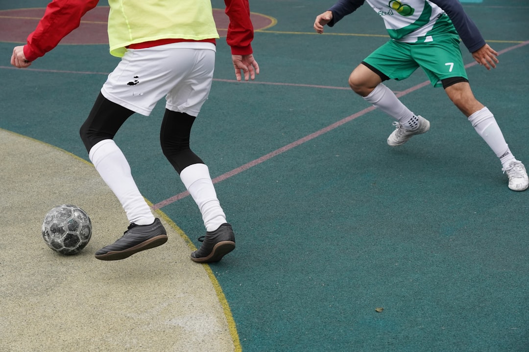 a group of people playing football county sports partnership, funding, sport england, grants