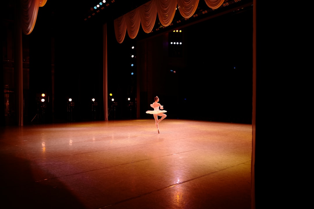 a person is doing a dance on a stage dancer, athletic, performance stage