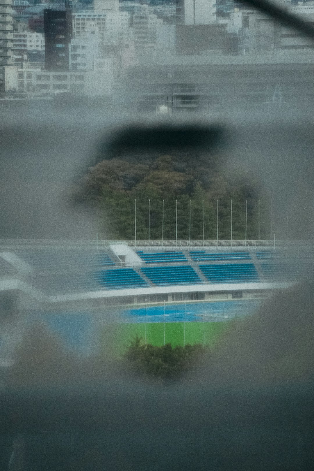 a view of a stadium through a window football weather delay rain thunderstorm stadium