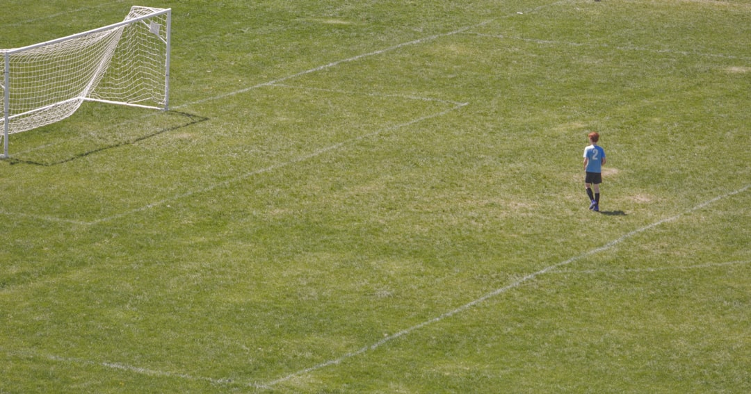 a young boy standing in front of a soccer goal expected goals shot quality football tactics