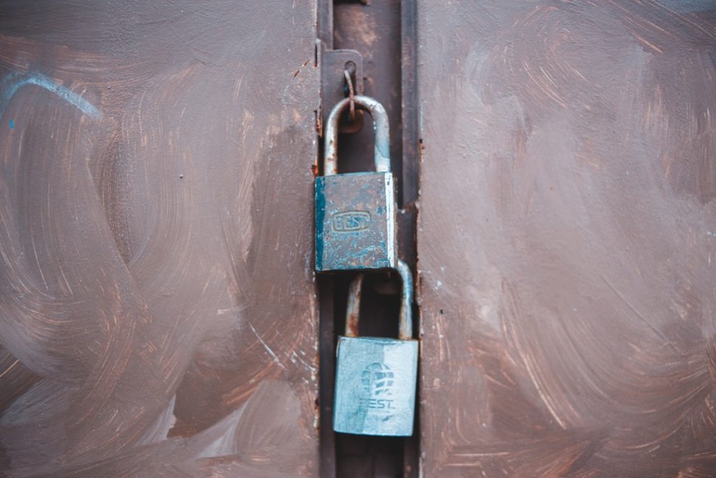 black and silver padlock on white plastic multifactor authentication, login security, mobile verification