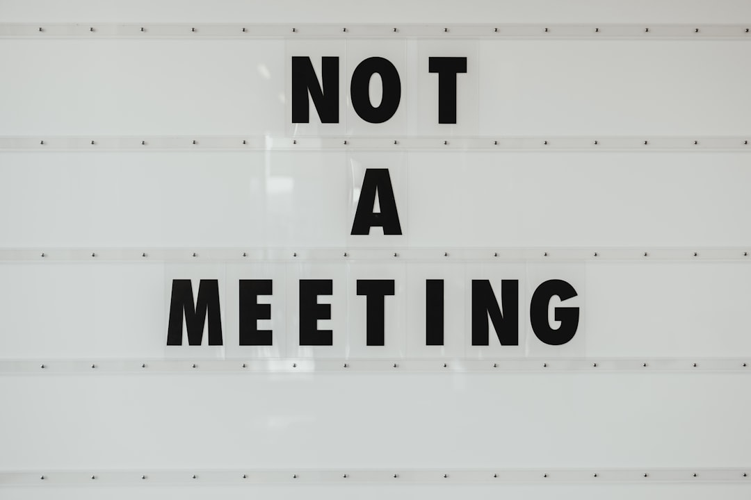 black note a meeting sign on wall sales meeting metrics marketing