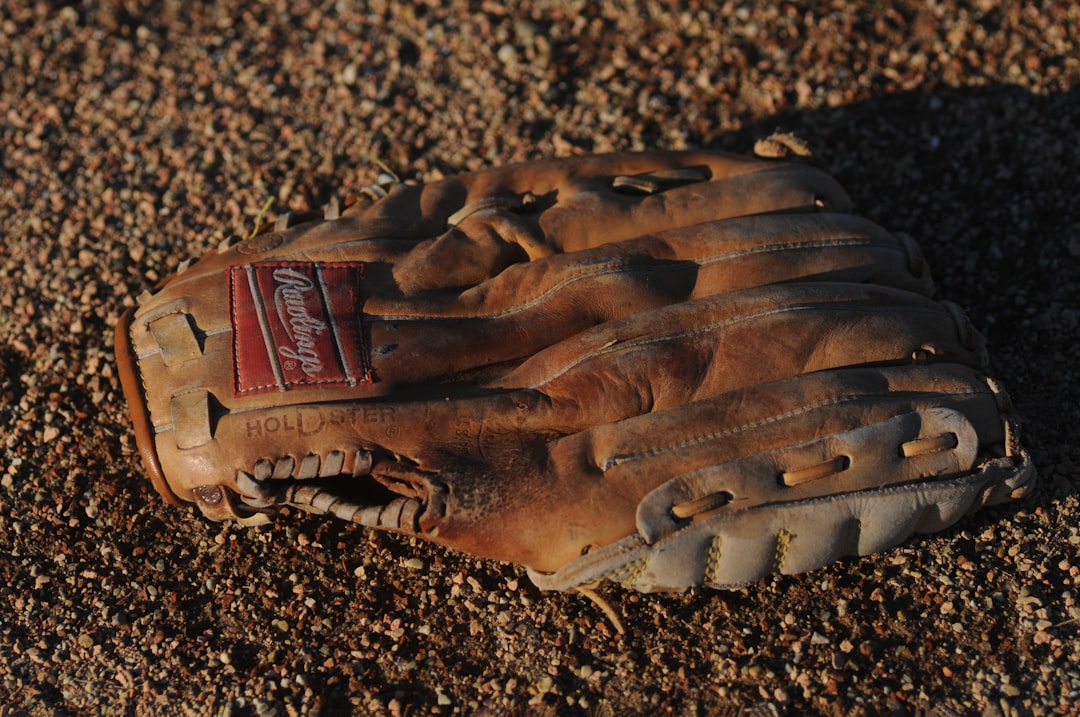 brown Remington leather baseball mitt baseball gloves shopping, sports store, youth baseball equipment
