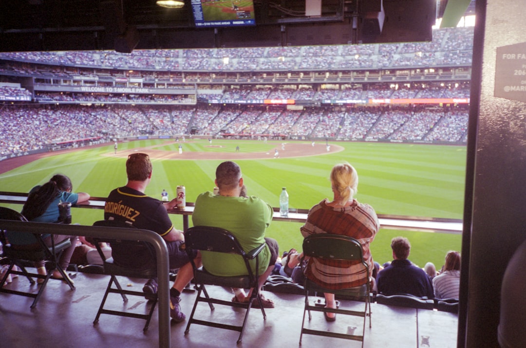 Fans watch a baseball game from their seats. fans baseball watching tv betting