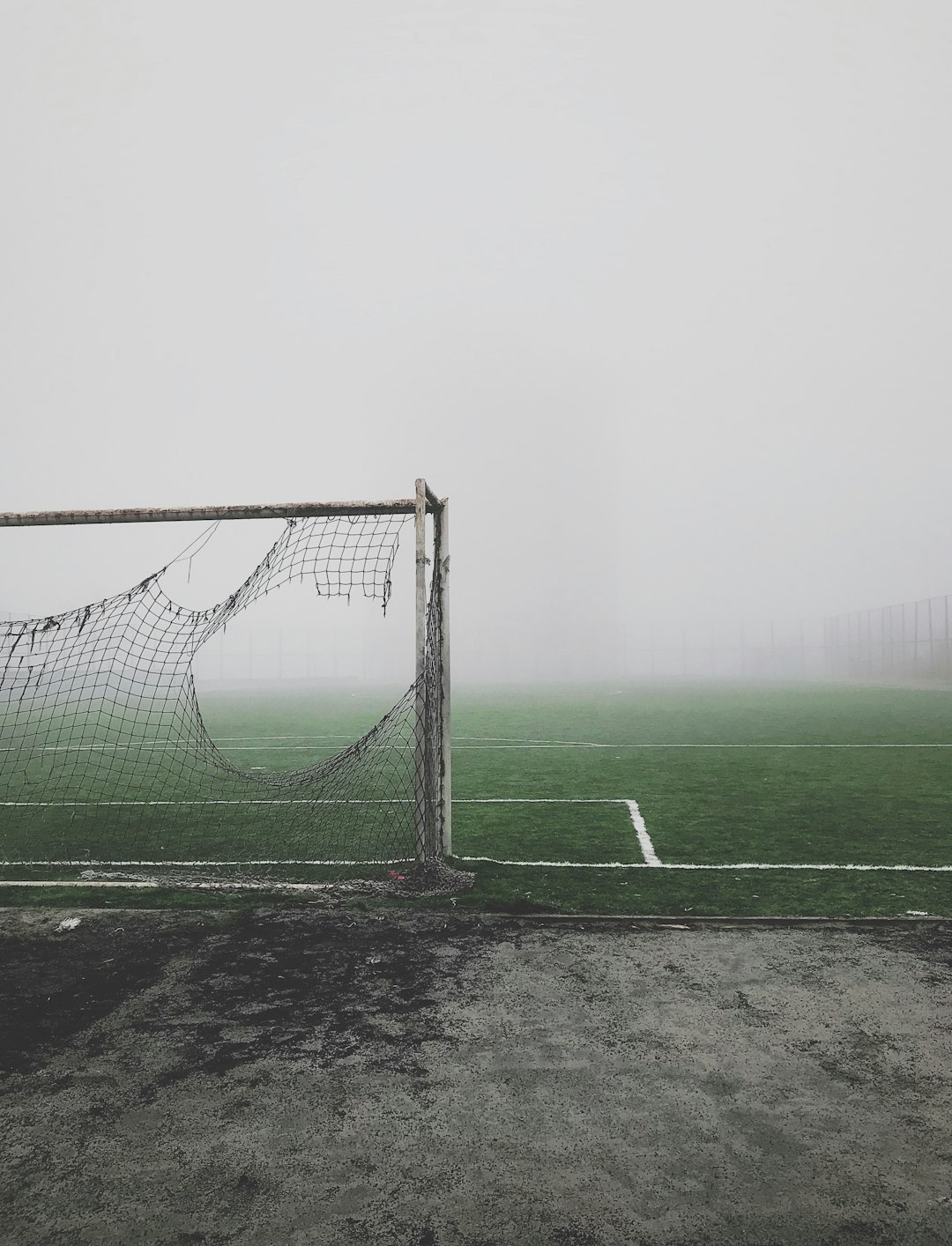 gray and white soccer goal football game rain, outdoor sports weather, athlete cold conditions