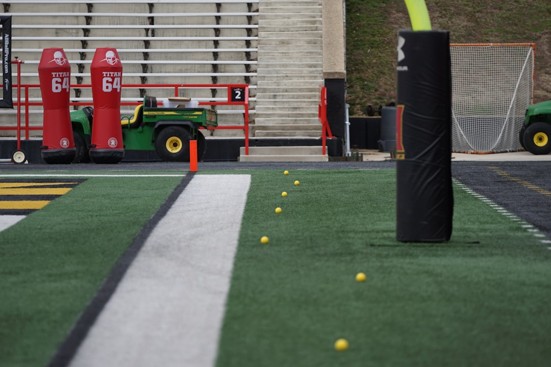 green utility truck near field ladder drill, cone drill, speed training, football agility