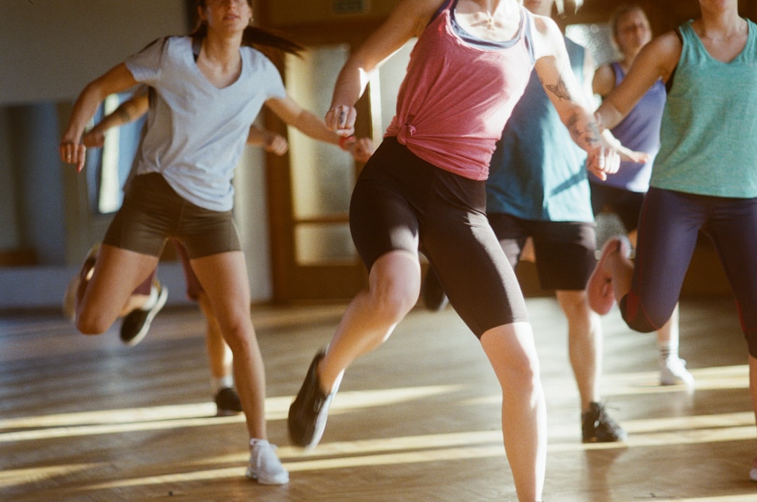 group of women running on brown wooden floor competitive ballroom dance, dance competition, athletic dancers