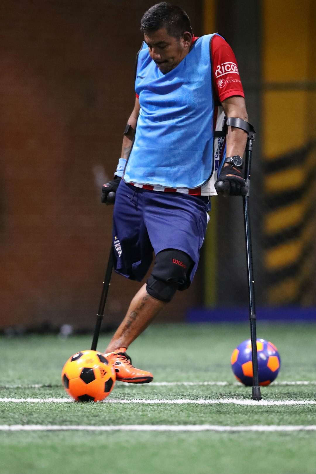 man playing soccer during daytime football injury player medical trainers