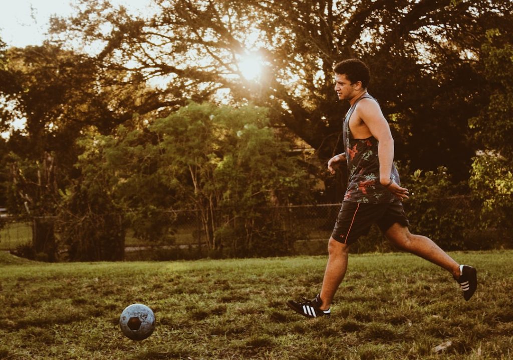 man playing soccer during daytime football player retirement, planning future, athlete transition