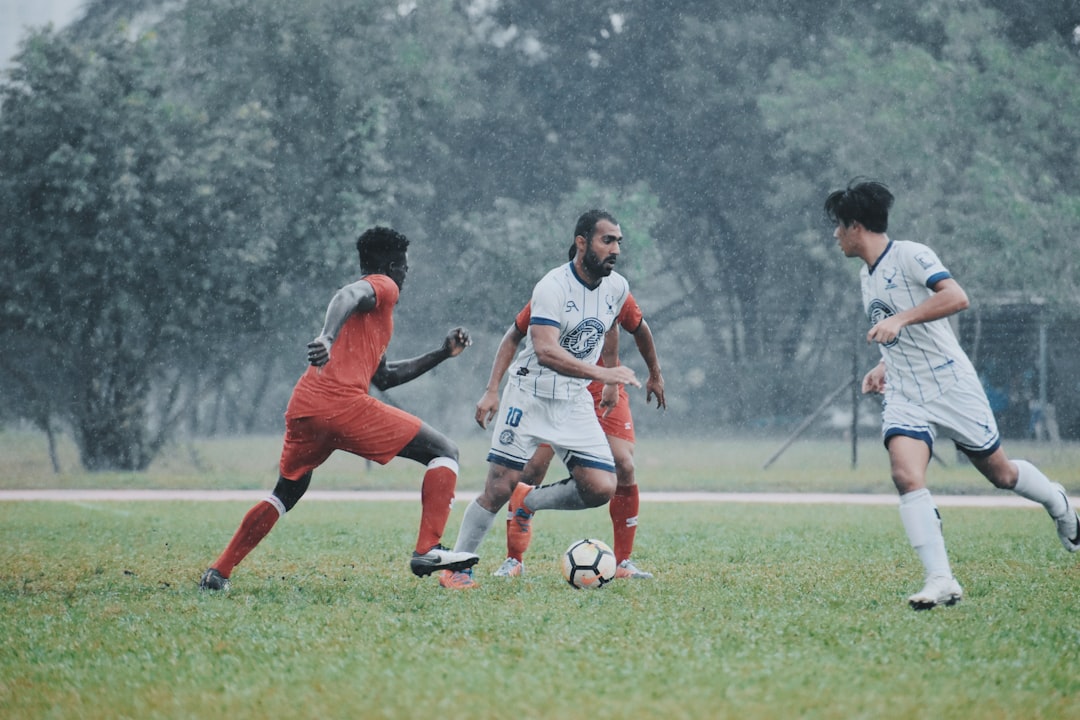 men playing soccer on green grass field during daytime dynasty league, fantasy football, player ranking