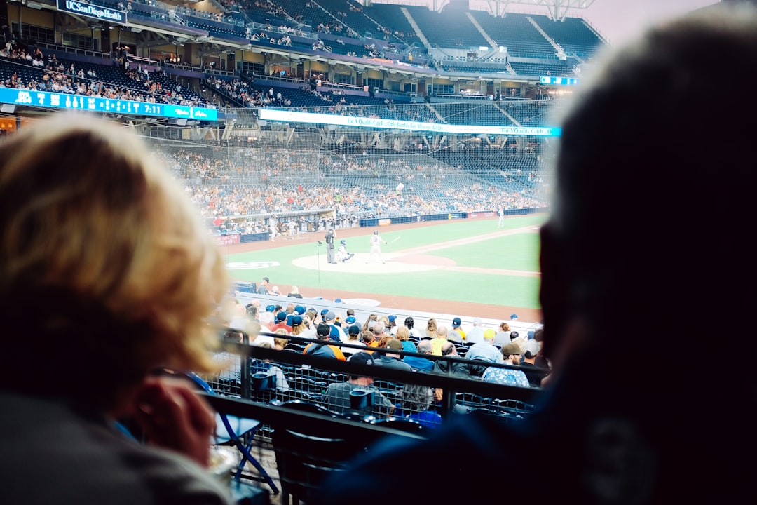 people watching on stadium during daytime fans baseball watching tv betting