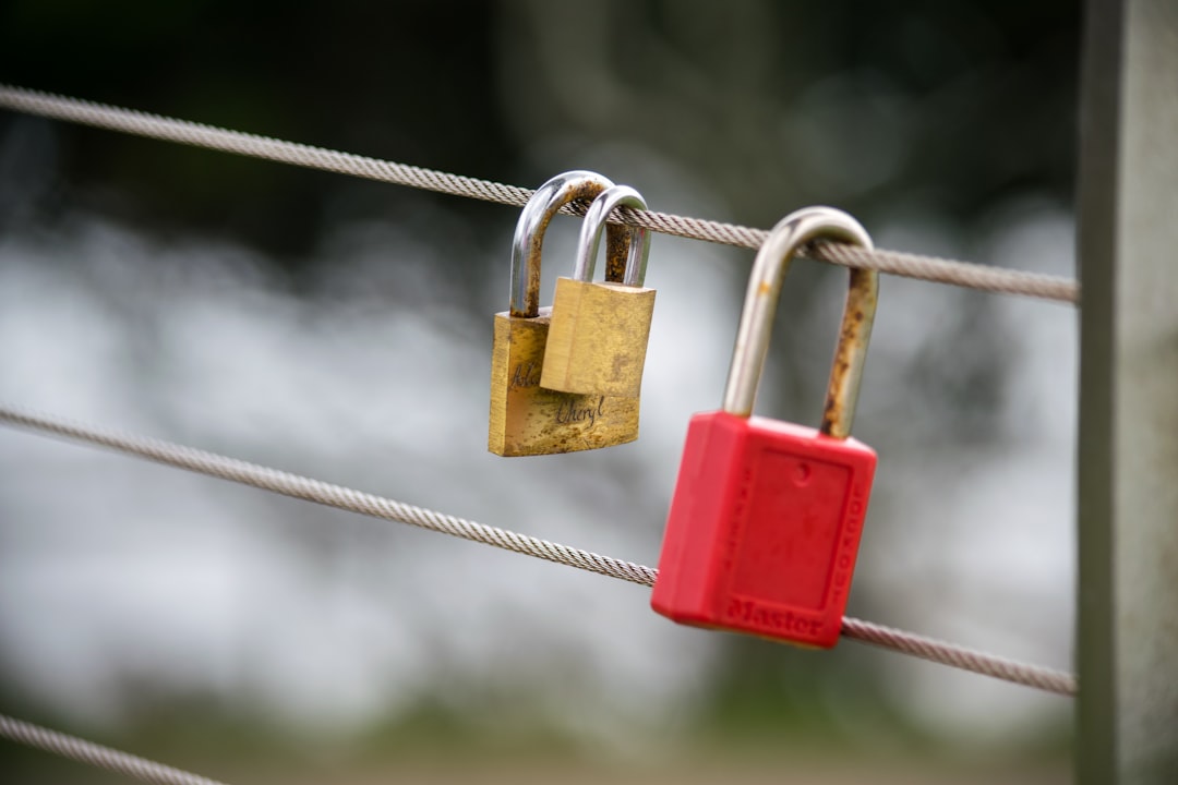 red padlock on gray wire multifactor authentication, login security, mobile verification
