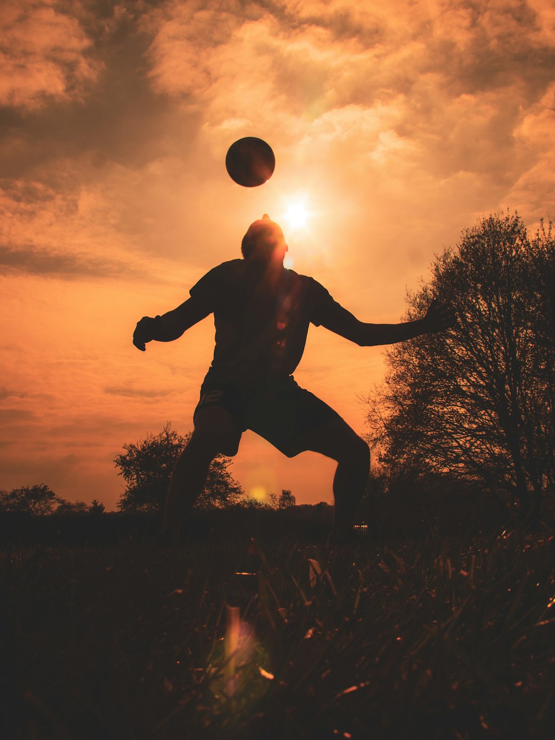 silhouette of man jumping on grass field during sunset football player retirement, planning future, athlete transition