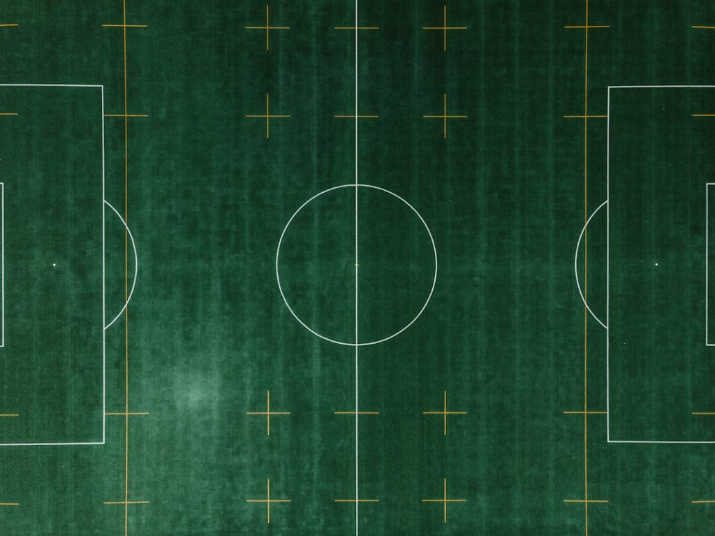 soccer field aerial photo football player smart gear data analytics tablet