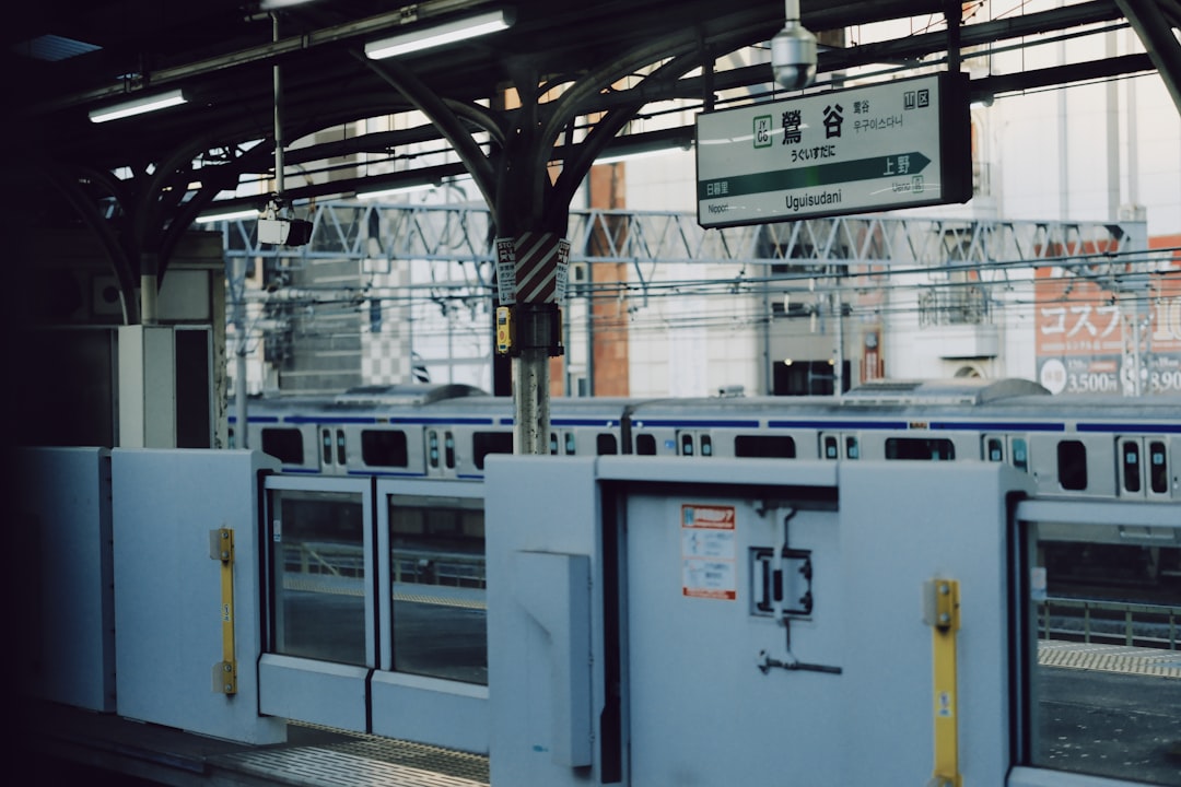 Train station platform with closed doors and train manufacturing machinery production