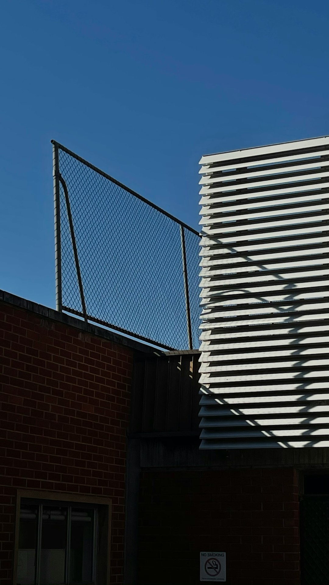 white and brown concrete building baseball stadium wind weather sunny