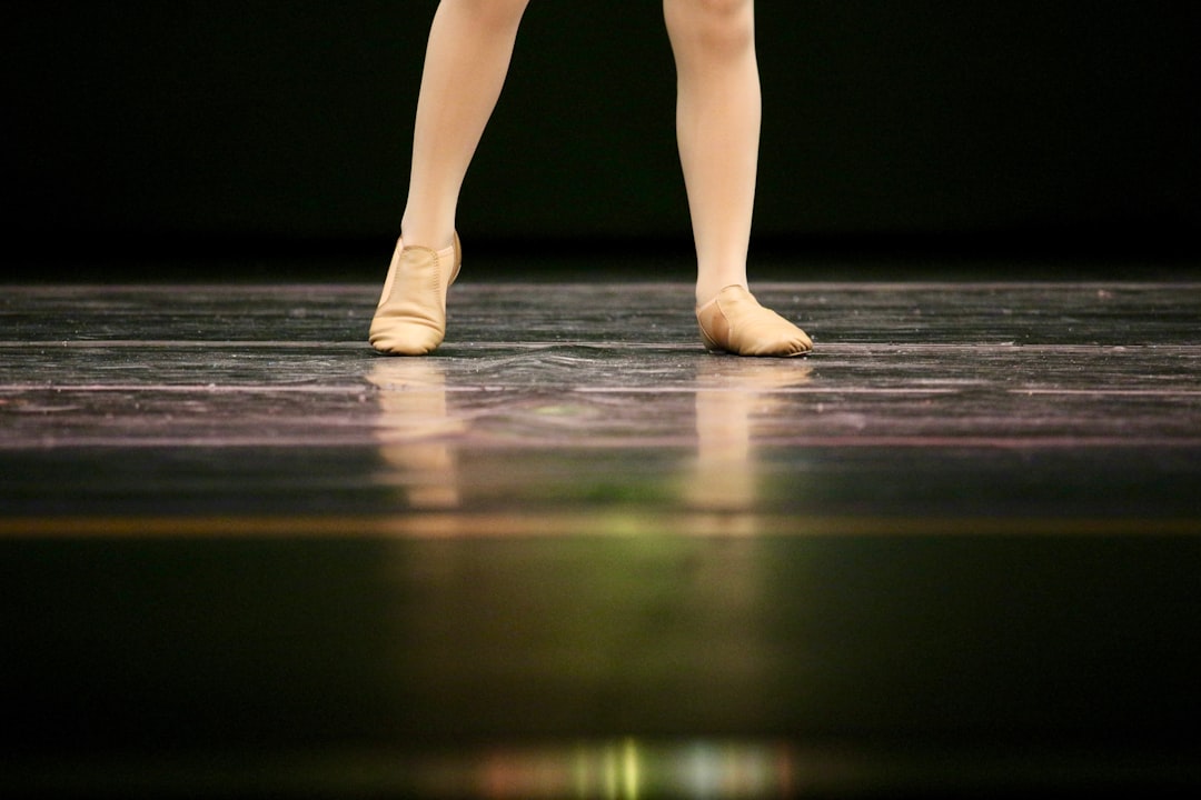 woman standing wearing valley shoes dancer, athletic, performance stage