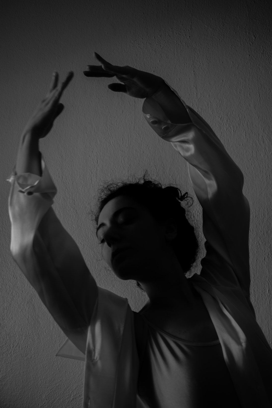 Woman with arms raised in graceful pose ballet dancer, emotional expression, artistic dance