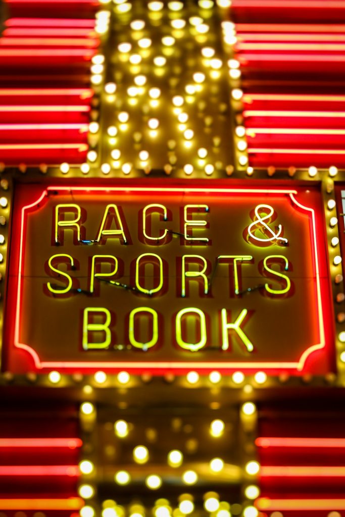 yellow and red race sports & book neon light betting spreadsheet, sports statistics, tracking software