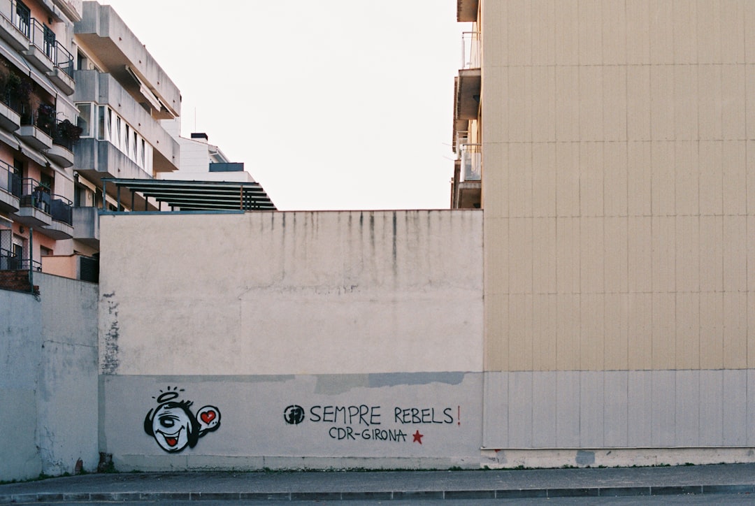 a building with a graffiti on the side of it girona players, spanish football, la liga stadium