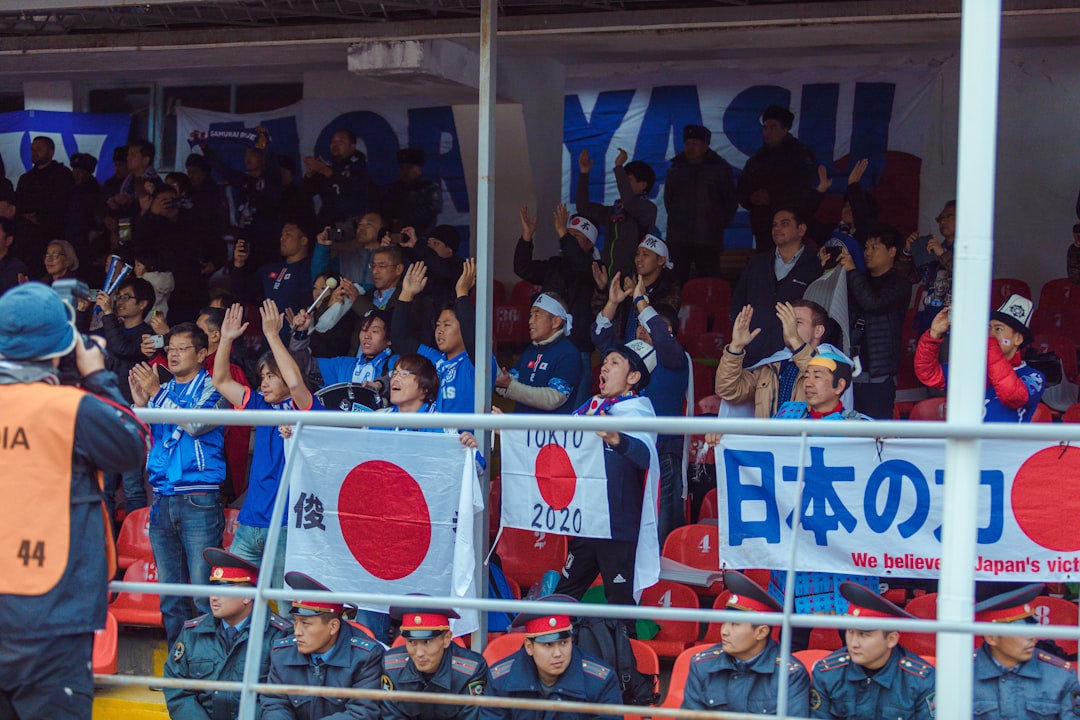 a crowd of people standing next to each other npb teams, fukuoka softbank hawks, hiroshima carp fans