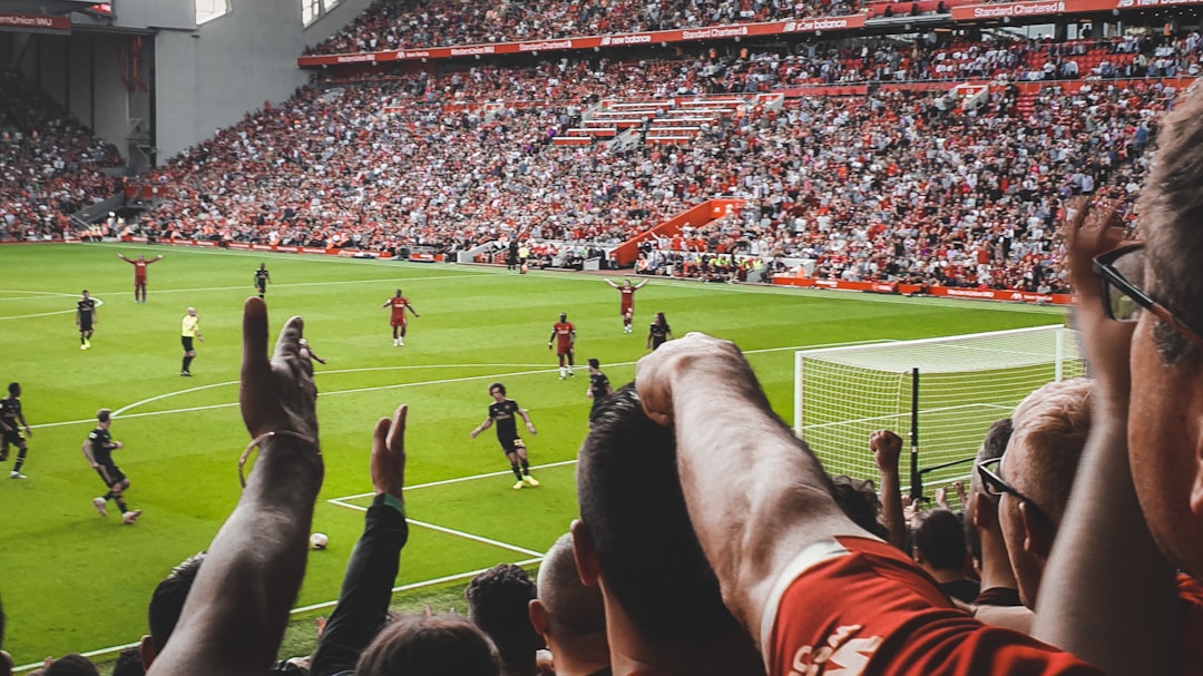 a crowd of people watching a soccer game football community, fans chatting, online sports discussion