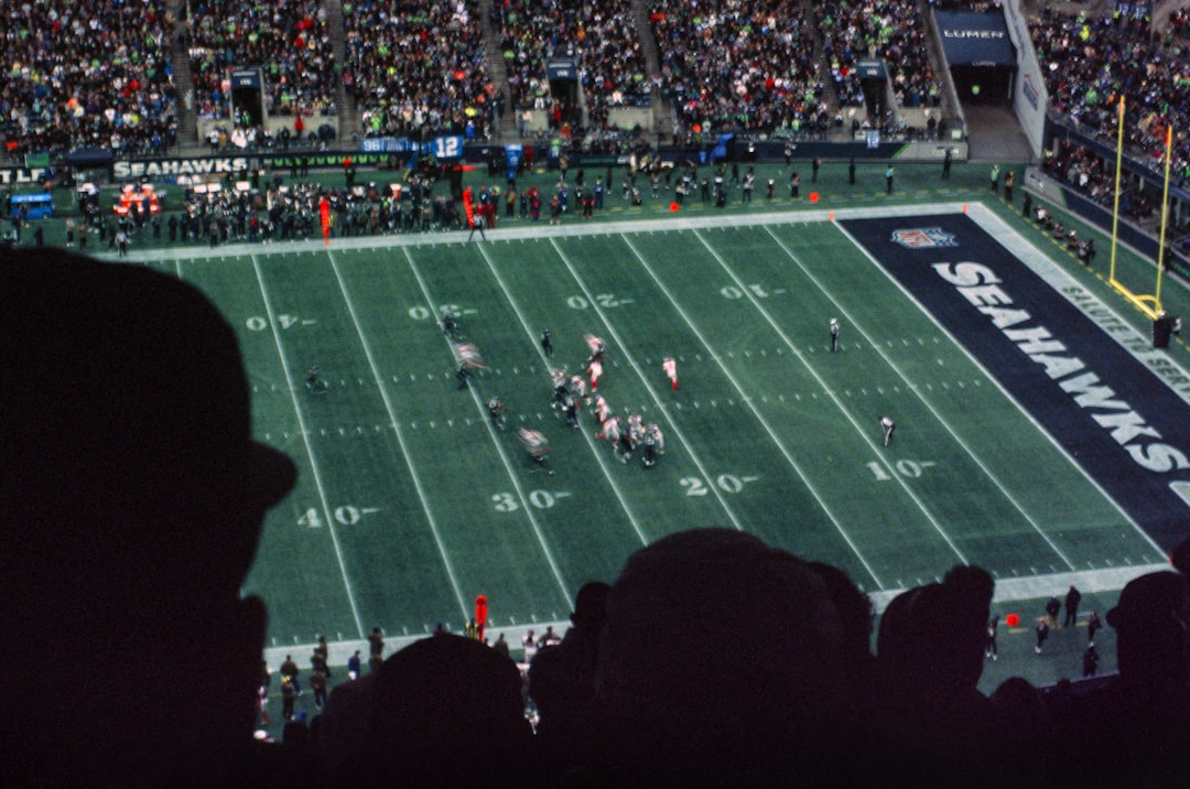 a football game is being played at a stadium american football game, stadium lights, referee whistle