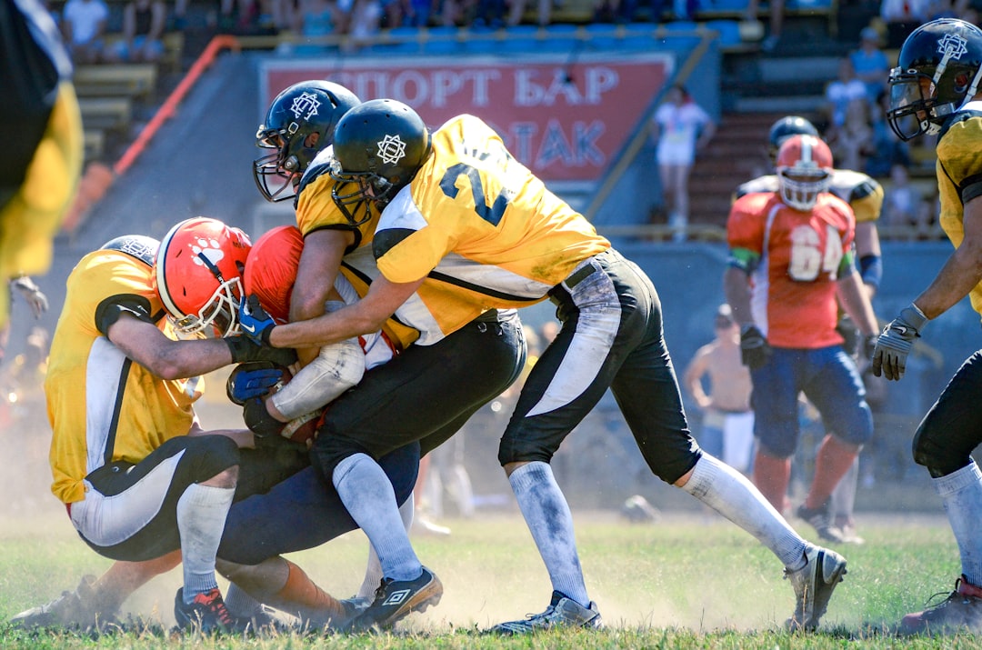 a group of football players playing a game of football football linebacker blitz quarterback tackle