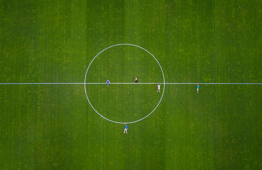 a group of people playing football football team technology strategy