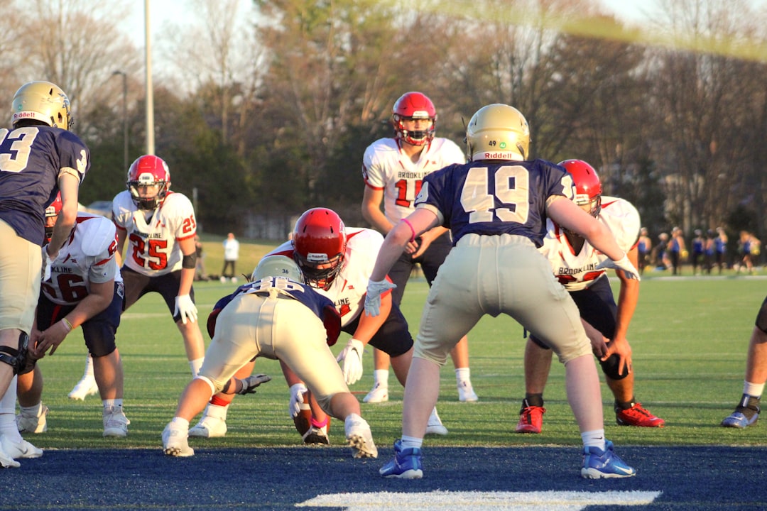 a group of young men playing a game of football football linebacker blitz quarterback tackle