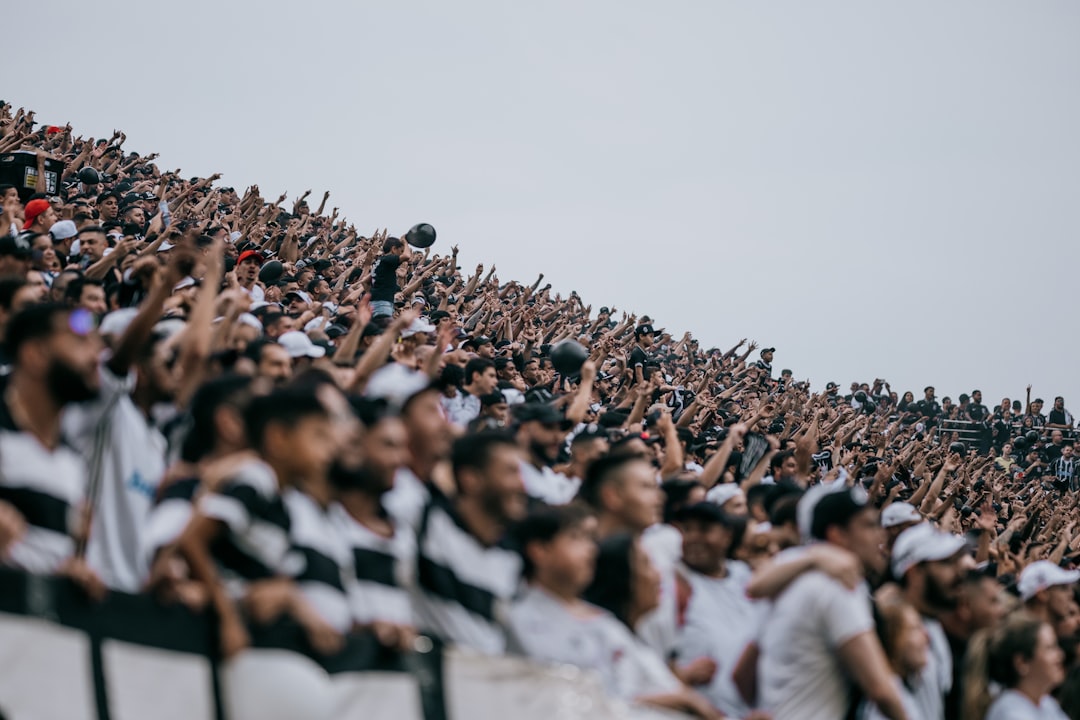 A large crowd of people at a sporting event hawaii football, stanford matchup, college football crowd